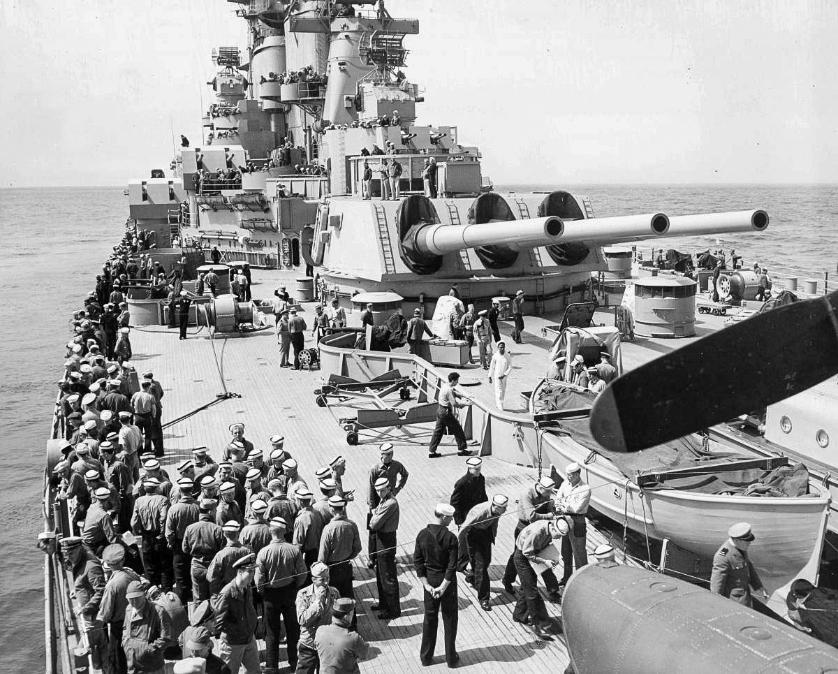 NROTC midshipmen, officers, and bluejackets pack the lifeline of the USS Iowa (BB-61)